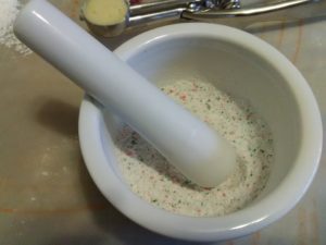 image of candy cane and sugar mixture in mortar