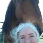 Image of horse and woman. You know when your horse trusts you, he becomes your hair stylist.
